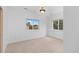 Bright bedroom featuring two large windows and a neutral decor at 1172 S Steele St, Denver, CO 80210