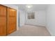 Neutral bedroom with closet, window and carpet at 1172 S Steele St, Denver, CO 80210