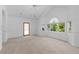 Spacious bedroom with high ceilings, neutral carpet, and natural light from several windows at 1172 S Steele St, Denver, CO 80210
