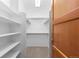 Organized walk-in closet featuring ample shelving and hanging storage at 1172 S Steele St, Denver, CO 80210