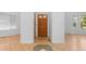 Bright and airy foyer with hardwood floors, a wooden door, and plenty of natural light at 1172 S Steele St, Denver, CO 80210