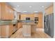 Large kitchen featuring stainless steel appliances, granite countertops, and center island at 1172 S Steele St, Denver, CO 80210