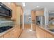 Bright kitchen featuring stainless steel appliances, granite countertops, and hardwood flooring at 1172 S Steele St, Denver, CO 80210