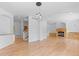 Bright living room with fireplace, hardwood floors, and open floor plan at 1172 S Steele St, Denver, CO 80210