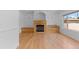 Cozy living room with fireplace, built-ins, and hardwood floors at 1172 S Steele St, Denver, CO 80210