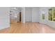 Spacious living area with hardwood floors, arched doorways, and natural light at 1172 S Steele St, Denver, CO 80210