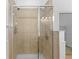 Glass enclosed tile shower with a built-in seat and multiple shower heads at 1172 S Steele St, Denver, CO 80210