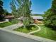 Charming home with a well-maintained lawn, mature trees, and inviting curb appeal at 2300 Crabtree Dr, Centennial, CO 80121