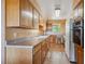 Functional kitchen featuring ample cabinetry, a double sink, and lots of counter space at 2300 Crabtree Dr, Centennial, CO 80121