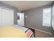 This bedroom has a closet, window with shutters, and neutral carpet at 9864 Carmel Ct, Lone Tree, CO 80124