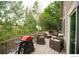 Outdoor deck with grill and furniture surrounded by a green, lush yard at 9864 Carmel Ct, Lone Tree, CO 80124