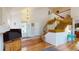 Bright entryway with hardwood floors, staircase, and open access to the living spaces at 9864 Carmel Ct, Lone Tree, CO 80124