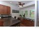Eat-in kitchen area with stainless appliances, granite countertops, and custom-built bench seating under the window at 9864 Carmel Ct, Lone Tree, CO 80124