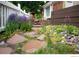 A stone path and flowers add color to the landscape at 9864 Carmel Ct, Lone Tree, CO 80124