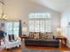 Spacious living room with a large window, hardwood floors, and comfortable seating at 9864 Carmel Ct, Lone Tree, CO 80124