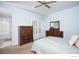 This main bedroom features a ceiling fan and large window with shutters at 9864 Carmel Ct, Lone Tree, CO 80124
