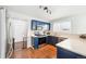 Cozy kitchen with blue cabinets, modern appliances and a view of the backyard at 13036 W Cross Dr, Littleton, CO 80127