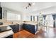 The open kitchen layout flows into the dining area, creating a cozy atmosphere at 13036 W Cross Dr, Littleton, CO 80127