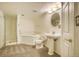 Well-lit bathroom featuring a shower, tub, toilet, and pedestal sink at 13634 Monroe St, Thornton, CO 80602