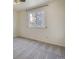 Bright bedroom featuring a large window and neutral carpeting at 13634 Monroe St, Thornton, CO 80602