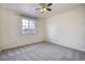 Bright bedroom features a large window and neutral carpeting at 13634 Monroe St, Thornton, CO 80602