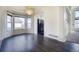 Dining area with bay window, chandelier, and an open view to the kitchen at 13634 Monroe St, Thornton, CO 80602