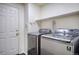 Well-equipped laundry room with modern washer and dryer at 13634 Monroe St, Thornton, CO 80602