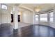 Well-lit open-concept living area with large windows and chandelier, offering a comfortable and inviting atmosphere at 13634 Monroe St, Thornton, CO 80602