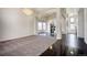 Open-concept living area with elegant lighting fixtures and ample space for entertaining at 13634 Monroe St, Thornton, CO 80602