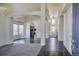 Bright living space featuring chandeliers, an open floor plan, and archways at 13634 Monroe St, Thornton, CO 80602