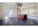 A room with a ceiling fan and desk at 13634 Monroe St, Thornton, CO 80602