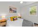 Bedroom featuring hardwood floors, ceiling fan, and bedside tables with lamps at 936 Utica St, Denver, CO 80204