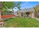 Charming home featuring a well-maintained lawn and a cozy front porch with seating at 936 Utica St, Denver, CO 80204