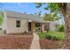 Inviting home exterior with a covered porch and landscaped front yard, creating a welcoming curb appeal at 936 Utica St, Denver, CO 80204