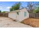 Detached garage with double doors, painted in neutral colors, with additional parking at 936 Utica St, Denver, CO 80204