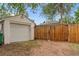 Spacious detached garage with a privacy fence, offering secure parking and additional storage space at 936 Utica St, Denver, CO 80204