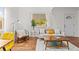 Living room with hardwood floors, stylish furniture, and natural light creating a warm and inviting space at 936 Utica St, Denver, CO 80204
