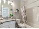 Clean bathroom with a vanity, granite counters, tiled tub/shower and neutral color palette at 9612 Reunion Pkwy, Commerce City, CO 80022