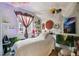 Unique bedroom featuring eclectic decor, natural light, and comfortable furnishings at 9612 Reunion Pkwy, Commerce City, CO 80022
