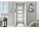 Inviting entryway with decorative mirrors, natural light, and stylish decor at 9612 Reunion Pkwy, Commerce City, CO 80022