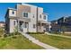 Modern townhome with well-maintained landscaping and a welcoming entrance at 9612 Reunion Pkwy, Commerce City, CO 80022