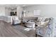 Open concept living room with modern furnishings and great natural light at 9612 Reunion Pkwy, Commerce City, CO 80022