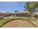 Spacious backyard featuring a patio, unfinished area and lush green lawn, perfect for outdoor activities and relaxation at 11816 Spring Dr, Northglenn, CO 80233