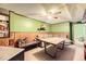 Finished basement with a bar area, wood paneling, and carpet flooring at 11816 Spring Dr, Northglenn, CO 80233
