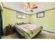 Basement bedroom with neutral carpet and a double bed beneath 2 windows at 11816 Spring Dr, Northglenn, CO 80233