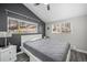 Cozy bedroom featuring a comfortable bed and picturesque views of the outdoors through large windows at 153 Sawmill Ln, Idaho Springs, CO 80452