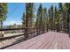Expansive deck overlooking a lush forest, offering a serene outdoor retreat at 153 Sawmill Ln, Idaho Springs, CO 80452