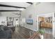 Open living room with fireplace and scenic mountain views, seamlessly flowing into the kitchen at 153 Sawmill Ln, Idaho Springs, CO 80452