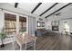Open living room featuring a dining table and fireplace, perfect for entertaining guests at 153 Sawmill Ln, Idaho Springs, CO 80452