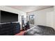 Well-lit bedroom featuring large window, sleek furniture and comfortable bed at 7881 Allison Way # 204, Arvada, CO 80005